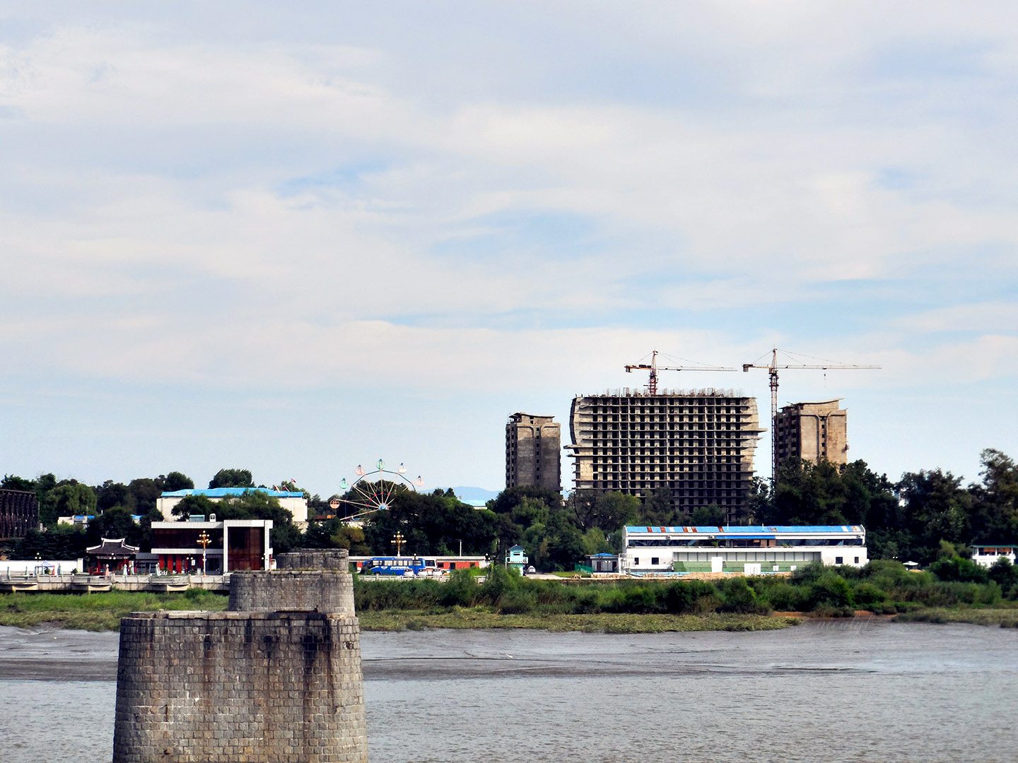 Sinuiju north korea across the yalu river, broken bridge dandong china